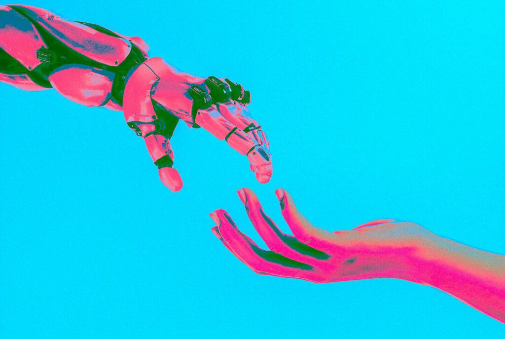 Symbolic illustration of a human hand reaching out to a robotic hand, depicting collaboration with AI